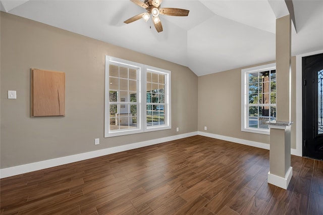 unfurnished living room featuring dark wood-type flooring, ceiling fan, and lofted ceiling