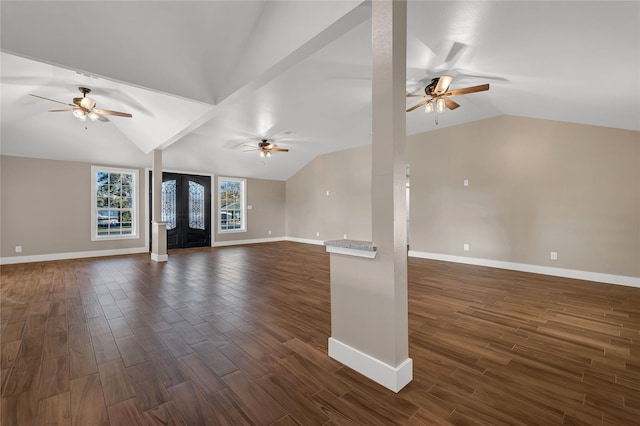 unfurnished living room with ceiling fan, lofted ceiling, and dark hardwood / wood-style flooring