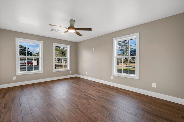 empty room featuring dark hardwood / wood-style floors and ceiling fan