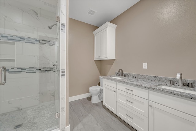 bathroom featuring walk in shower, vanity, and toilet