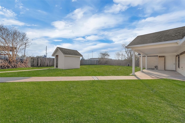 view of yard featuring a patio and a shed