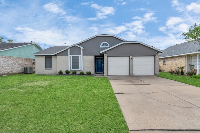 ranch-style house with a garage, a front yard, and central air condition unit