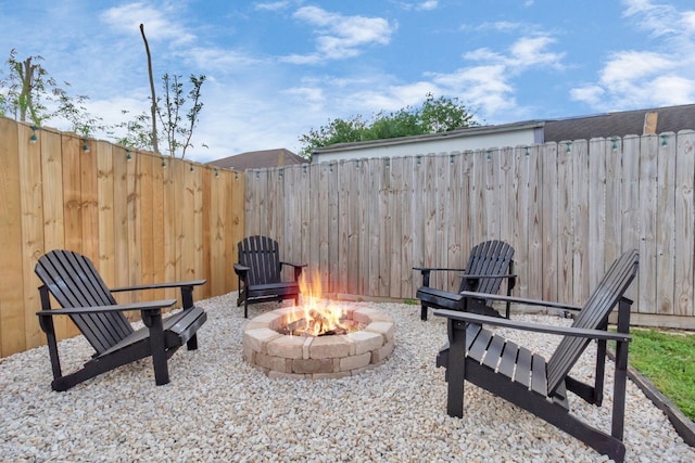 view of patio / terrace with an outdoor fire pit