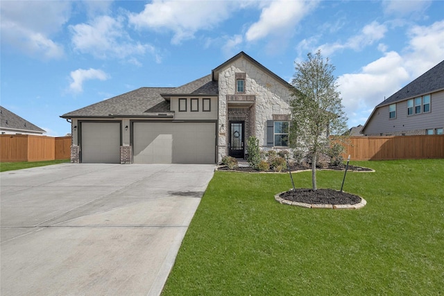 view of front facade featuring a garage and a front lawn