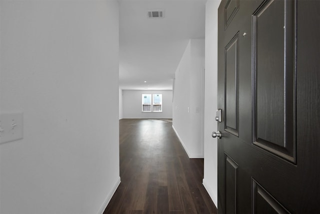 hallway featuring dark wood-type flooring