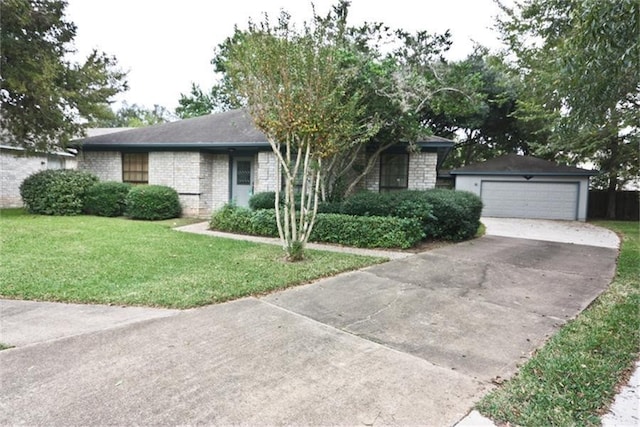 view of front of house featuring a garage and a front lawn