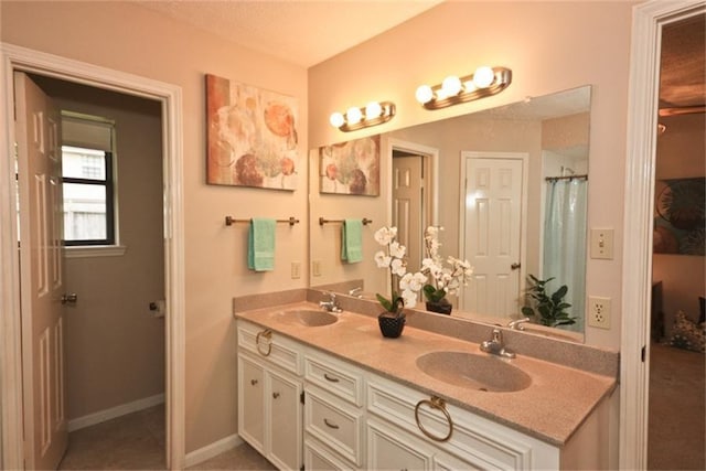 bathroom with vanity and tile patterned floors