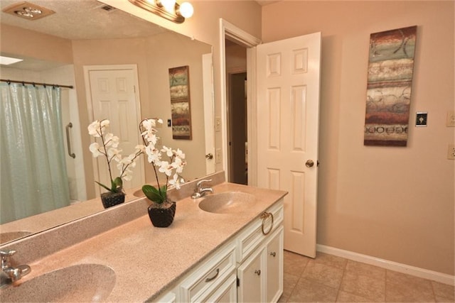 bathroom featuring vanity, curtained shower, and tile patterned floors