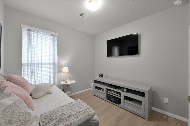 bedroom with light hardwood / wood-style flooring
