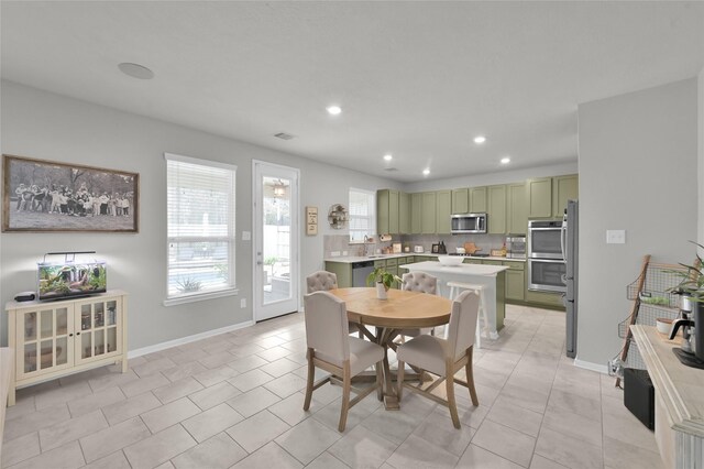 dining space featuring light tile patterned flooring