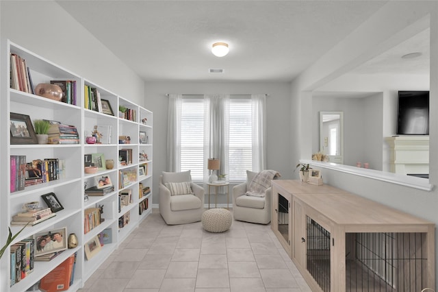 living area featuring light tile patterned floors