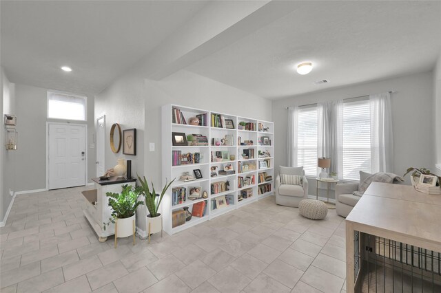 sitting room featuring light tile patterned floors