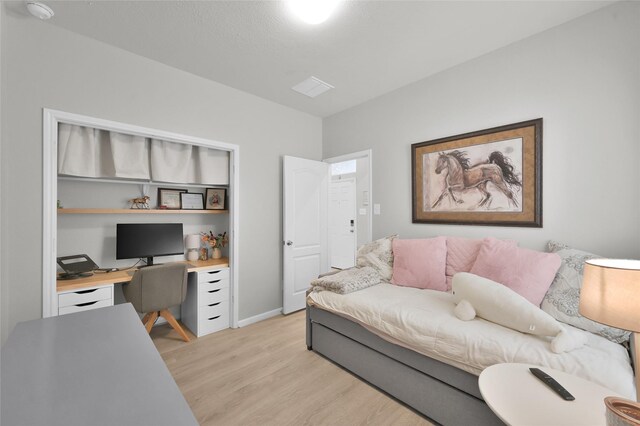 office space with light hardwood / wood-style flooring