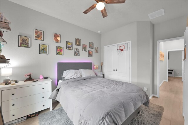 bedroom featuring ceiling fan and light wood-type flooring