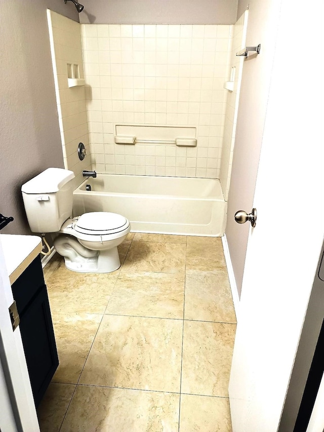 full bathroom featuring vanity, tiled shower / bath, tile patterned floors, and toilet