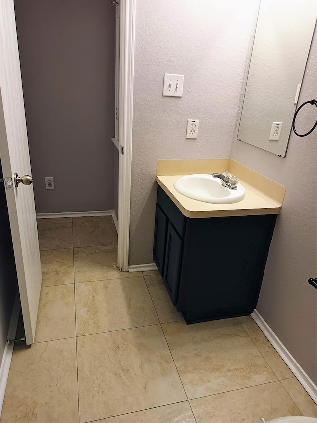 bathroom with vanity and tile patterned flooring