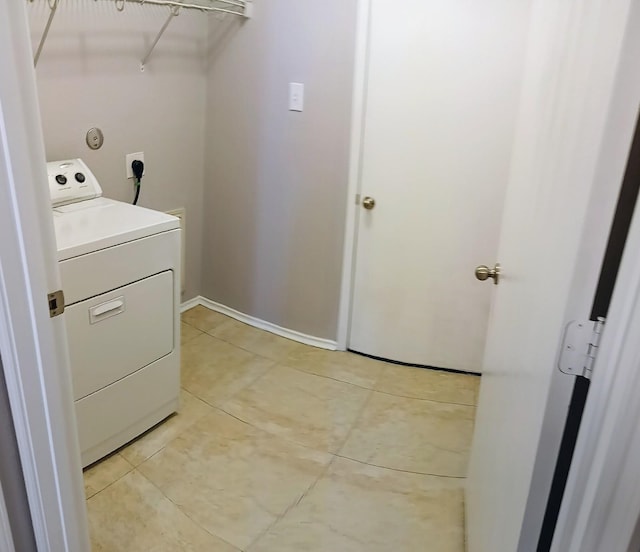 washroom featuring washer / dryer and light tile patterned floors