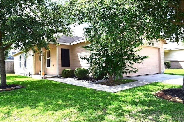 obstructed view of property with a garage and a front lawn