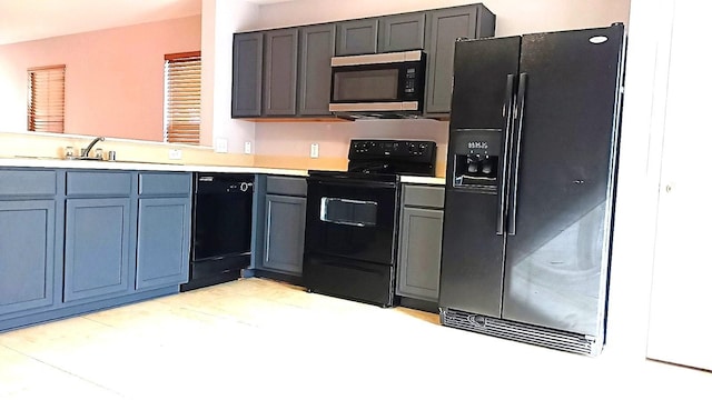 kitchen featuring sink and black appliances