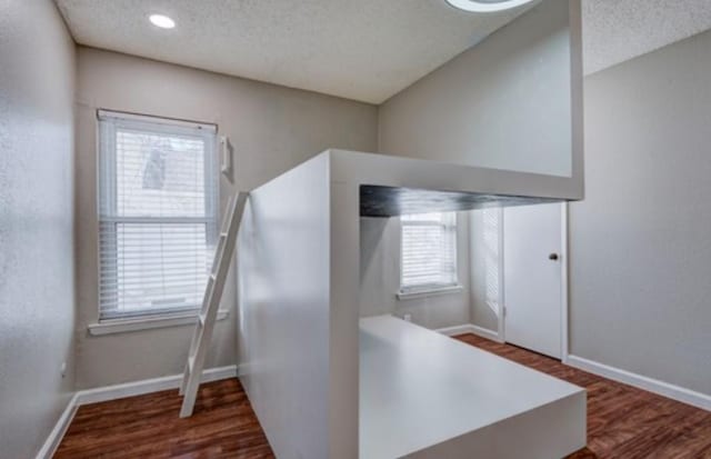 office area featuring hardwood / wood-style floors and a textured ceiling