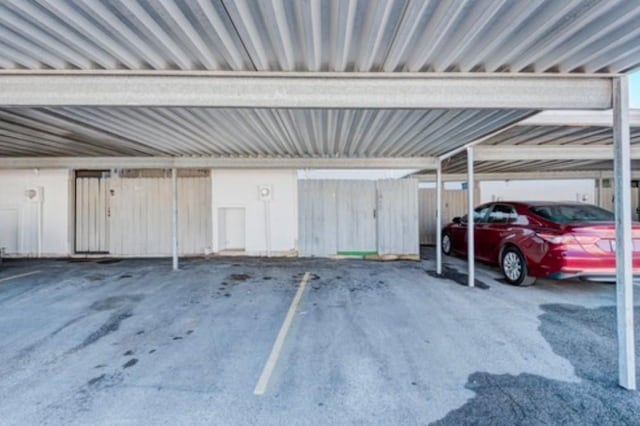 view of parking / parking lot with a carport