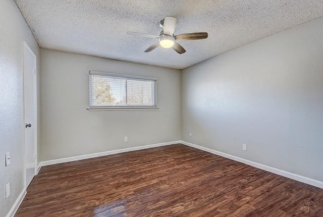 spare room featuring ceiling fan, dark hardwood / wood-style flooring, and a textured ceiling