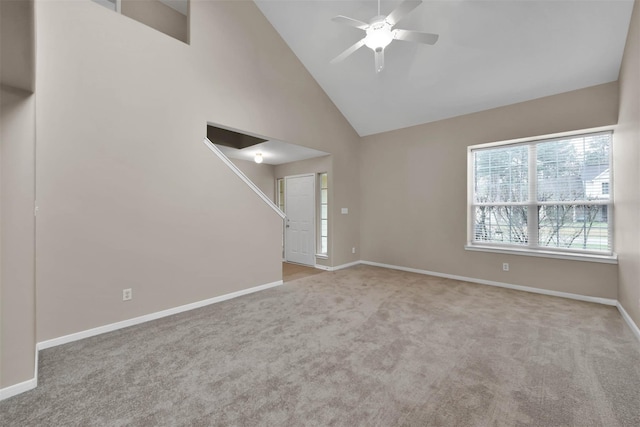 unfurnished living room featuring ceiling fan, light carpet, and high vaulted ceiling