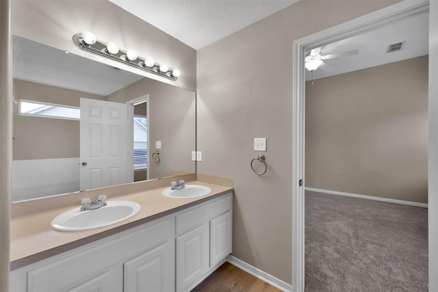 bathroom featuring vanity and ceiling fan