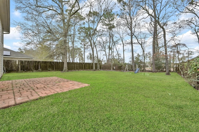 view of yard with a patio and a playground