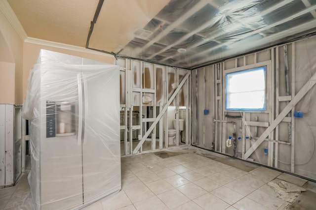 basement featuring light tile patterned floors