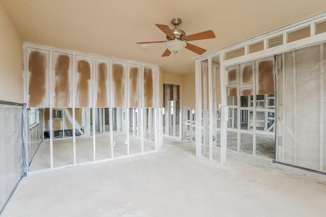 interior space featuring ceiling fan