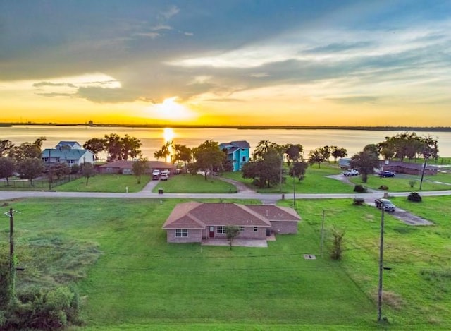 aerial view at dusk with a water view