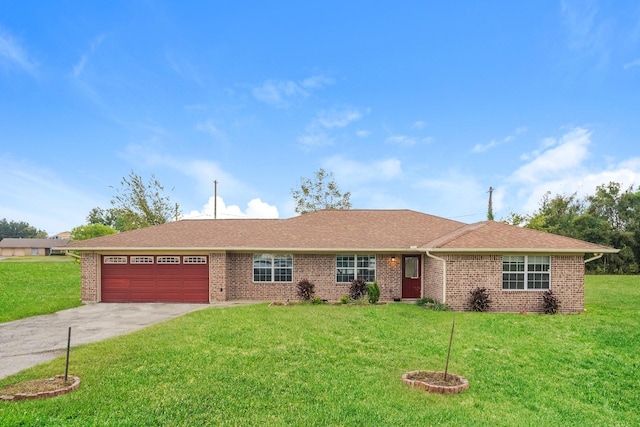 ranch-style house with a garage and a front yard