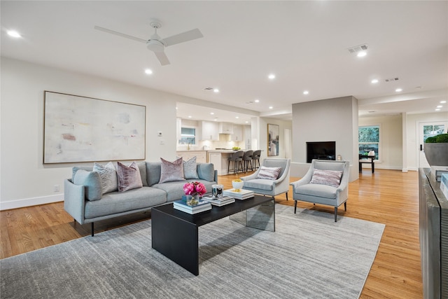 living room with light hardwood / wood-style flooring