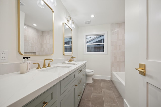 full bathroom featuring vanity, toilet, tiled shower / bath combo, and tile patterned flooring