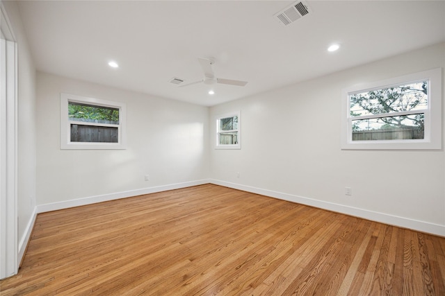 spare room with ceiling fan and light hardwood / wood-style floors