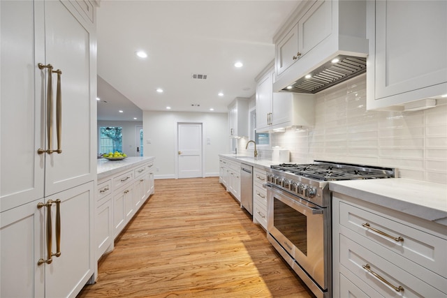 kitchen featuring white cabinetry and appliances with stainless steel finishes