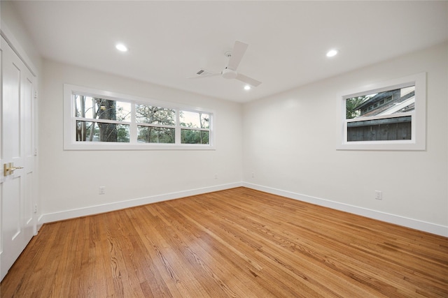 unfurnished room with ceiling fan and light hardwood / wood-style floors