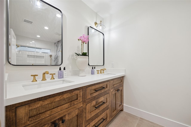 bathroom with tile patterned flooring, an enclosed shower, and vanity