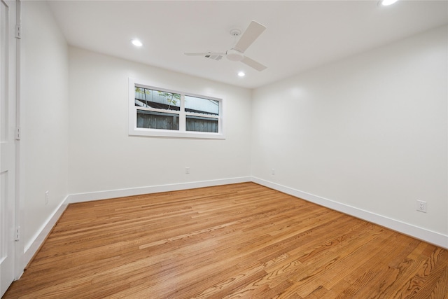 unfurnished room with ceiling fan and light hardwood / wood-style flooring