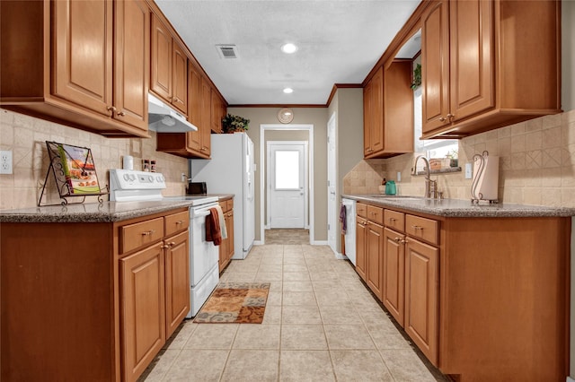 kitchen featuring tasteful backsplash, sink, ornamental molding, light tile patterned floors, and white appliances