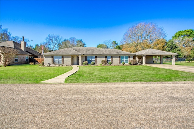 ranch-style home with a front lawn