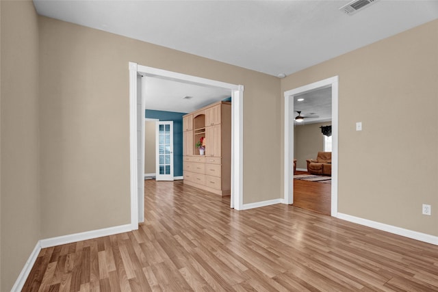 spare room featuring light wood-type flooring