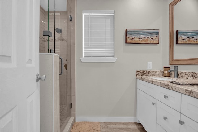 bathroom featuring vanity and walk in shower