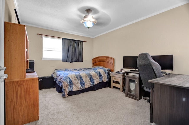 carpeted bedroom featuring ornamental molding and ceiling fan