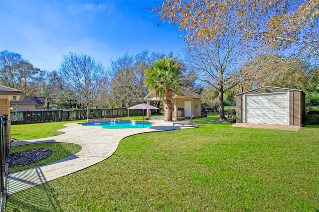 view of pool featuring a storage shed, a patio area, and a lawn