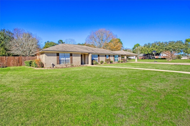 ranch-style home with a front lawn