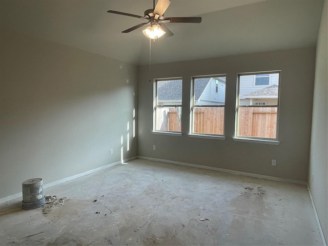 spare room featuring lofted ceiling and ceiling fan