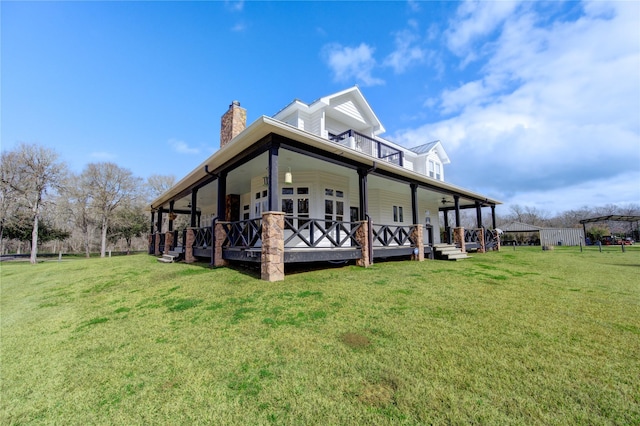 view of home's exterior with a porch and a yard