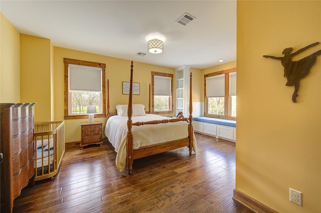 bedroom featuring dark hardwood / wood-style floors